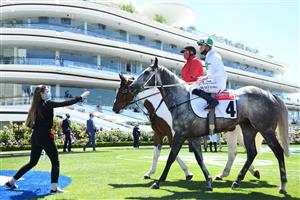 MELBOURNE, AUSTRALIA - NOVEMBER 02: Blaike McDougall riding #4 Excelman celebrates winning race 3, Resimax Group Subzero Handicap during 2021 Melbourne Cup Day at Flemington Racecourse on November 02, 2021 in Melbourne, Australia. (Photo by Vince Caligiuri/Getty Images)