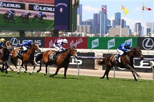 MELBOURNE, AUSTRALIA - NOVEMBER 02: Damien Oliver rides #9 Lackeen to win race 5, the Grinders Coffee Roasters Trophy during 2021 Melbourne Cup Day at Flemington Racecourse on November 02, 2021 in Melbourne, Australia. (Photo by Robert Cianflone/Getty Images)