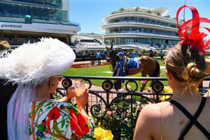 People attend the Melbourne Cup horse race as crowds are allowed to return to the Flemington racecourse in Melbourne on November 2, 2021. - - -- IMAGE RESTRICTED TO EDITORIAL USE - STRICTLY NO COMMERCIAL USE -- (Photo by William WEST / AFP) / -- IMAGE RESTRICTED TO EDITORIAL USE - STRICTLY NO COMMERCIAL USE -- (Photo by WILLIAM WEST/AFP via Getty Images)