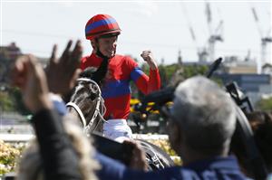 MELBOURNE, AUSTRALIA - NOVEMBER 02: James McDonald riding #4 Verry Elleegant celebrates winning race 7, the Lexus Melbourne Cup during 2021 Melbourne Cup Day at Flemington Racecourse on November 02, 2021 in Melbourne, Australia. (Photo by Darrian Traynor/Getty Images)