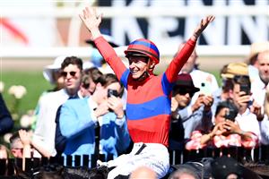 MELBOURNE, AUSTRALIA - NOVEMBER 02: James Mcdonald riding #4 Verry Elleegant celebrates after winning race 7, the Lexus Melbourne Cup during 2021 Melbourne Cup Day at Flemington Racecourse on November 02, 2021 in Melbourne, Australia. (Photo by Quinn Rooney/Getty Images)