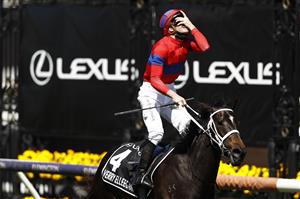 MELBOURNE, AUSTRALIA - NOVEMBER 02: James McDonald riding #4 Verry Elleegant celebrates winning race 7, the Lexus Melbourne Cup during 2021 Melbourne Cup Day at Flemington Racecourse on November 02, 2021 in Melbourne, Australia. (Photo by Darrian Traynor/Getty Images)