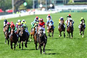 MELBOURNE, AUSTRALIA - NOVEMBER 02: James Mcdonald riding #4 Verry Elleegant celebrates winning race 7, the Lexus Melbourne Cup during 2021 Melbourne Cup Day at Flemington Racecourse on November 02, 2021 in Melbourne, Australia. (Photo by Quinn Rooney/Getty Images)