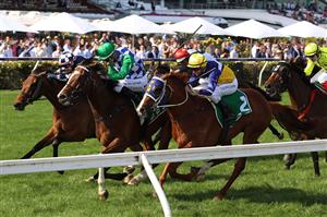 MELBOURNE, AUSTRALIA - NOVEMBER 02: Jordan Childs riding #6 Spirit Of Gaylard leads Nash Rawiller riding #2 Blushing Tycoon to win race 9, the TAB Trophy during 2021 Melbourne Cup Day at Flemington Racecourse on November 02, 2021 in Melbourne, Australia. (Photo by Robert Cianflone/Getty Images)