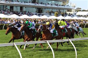 MELBOURNE, AUSTRALIA - NOVEMBER 02: Jordan Childs riding #6 Spirit Of Gaylard leads Nash Rawiller riding #2 Blushing Tycoon to win race 9, the TAB Trophy during 2021 Melbourne Cup Day at Flemington Racecourse on November 02, 2021 in Melbourne, Australia. (Photo by Robert Cianflone/Getty Images)