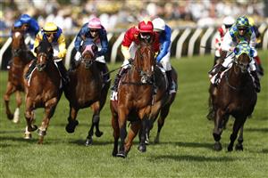 MELBOURNE, AUSTRALIA - NOVEMBER 02: Kerrin McEvoy riding #14 Quantico wins race 10, the MSS Security Sprint during 2021 Melbourne Cup Day at Flemington Racecourse on November 02, 2021 in Melbourne, Australia. (Photo by Darrian Traynor/Getty Images)