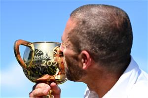 MELBOURNE, AUSTRALIA - NOVEMBER 02: Verry Elleegant owner Brae Sokolski kisses the Lexus Melbourne Cup after James Mcdonald rode #4 Verry Elleegant to victory in race 7, the Lexus Melbourne Cup during 2021 Melbourne Cup Day at Flemington Racecourse on November 02, 2021 in Melbourne, Australia. (Photo by Quinn Rooney/Getty Images)