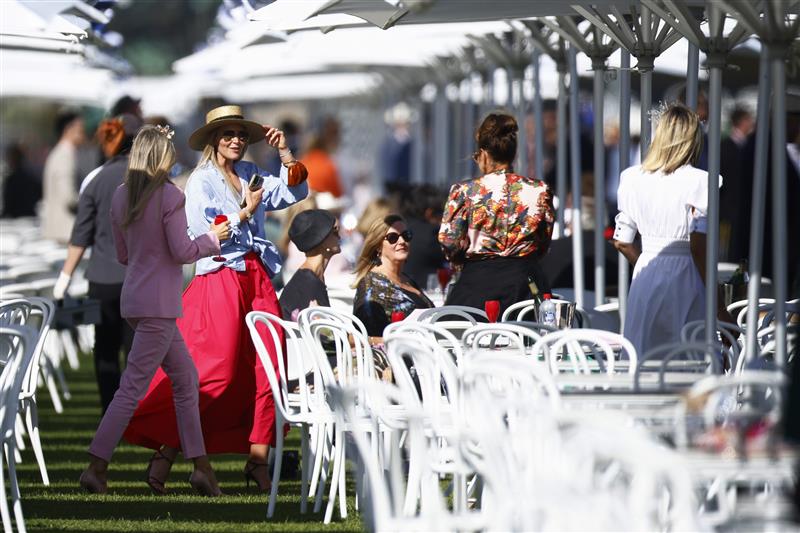 MELBOURNE, AUSTRALIA - NOVEMBER 04: Racegoers are seen during 2021 Oaks Day at Flemington Racecourse on November 04, 2021 in Melbourne, Australia. (Photo by Daniel Pockett/Getty Images)