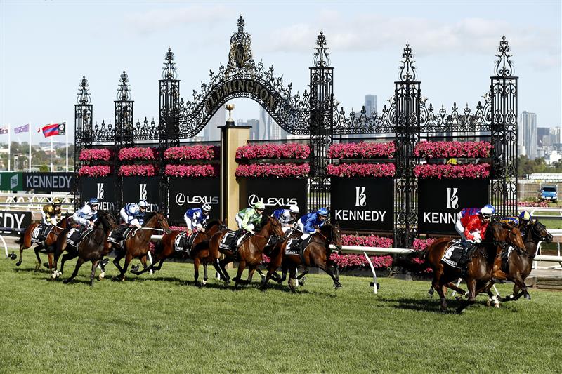 MELBOURNE, AUSTRALIA - NOVEMBER 04: The field gallop past the finish post for the first time in race 8, the Kennedy Oaks during 2021 Oaks Day at Flemington Racecourse on November 04, 2021 in Melbourne, Australia. (Photo by Darrian Traynor/Getty Images)