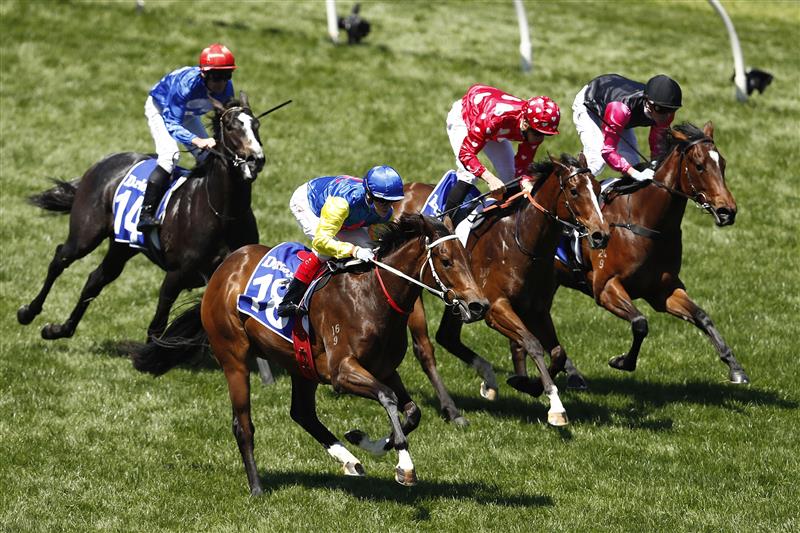MELBOURNE, AUSTRALIA - NOVEMBER 04: Craig Williams riding #18 See You In Heaven wins race 3, the Darley Ottawa Stakes during 2021 Oaks Day at Flemington Racecourse on November 04, 2021 in Melbourne, Australia. (Photo by Darrian Traynor/Getty Images)