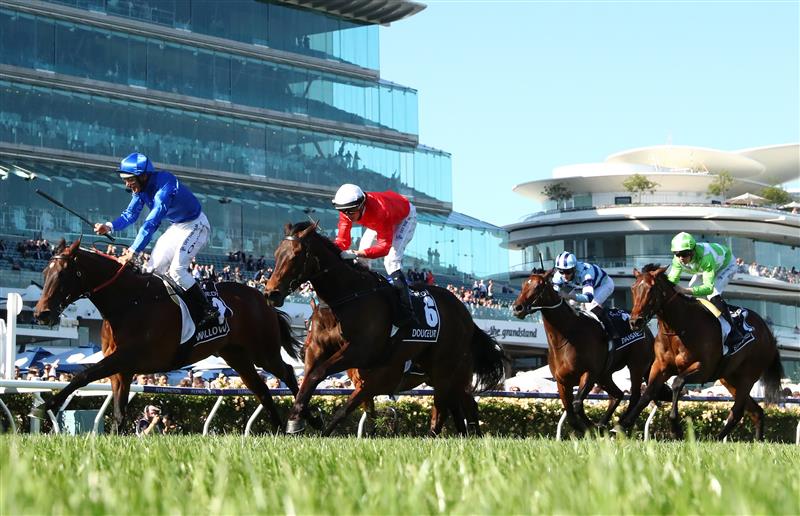 MELBOURNE, AUSTRALIA - NOVEMBER 04: Damien Oliver riding #2 Willowy leads Michael Dee #6 Douceur to win race 8, the Kennedy Oaks during 2021 Oaks Day at Flemington Racecourse on November 04, 2021 in Melbourne, Australia. (Photo by Robert Cianflone/Getty Images)