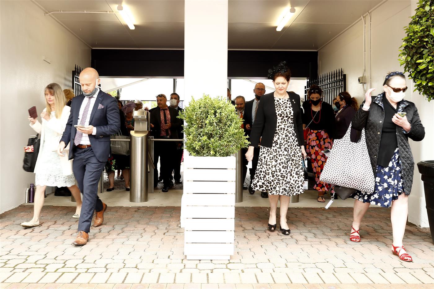 MELBOURNE, AUSTRALIA - NOVEMBER 04: Spectators walk through the gates during 2021 Oaks Day at Flemington Racecourse on November 04, 2021 in Melbourne, Australia. (Photo by Darrian Traynor/Getty Images)