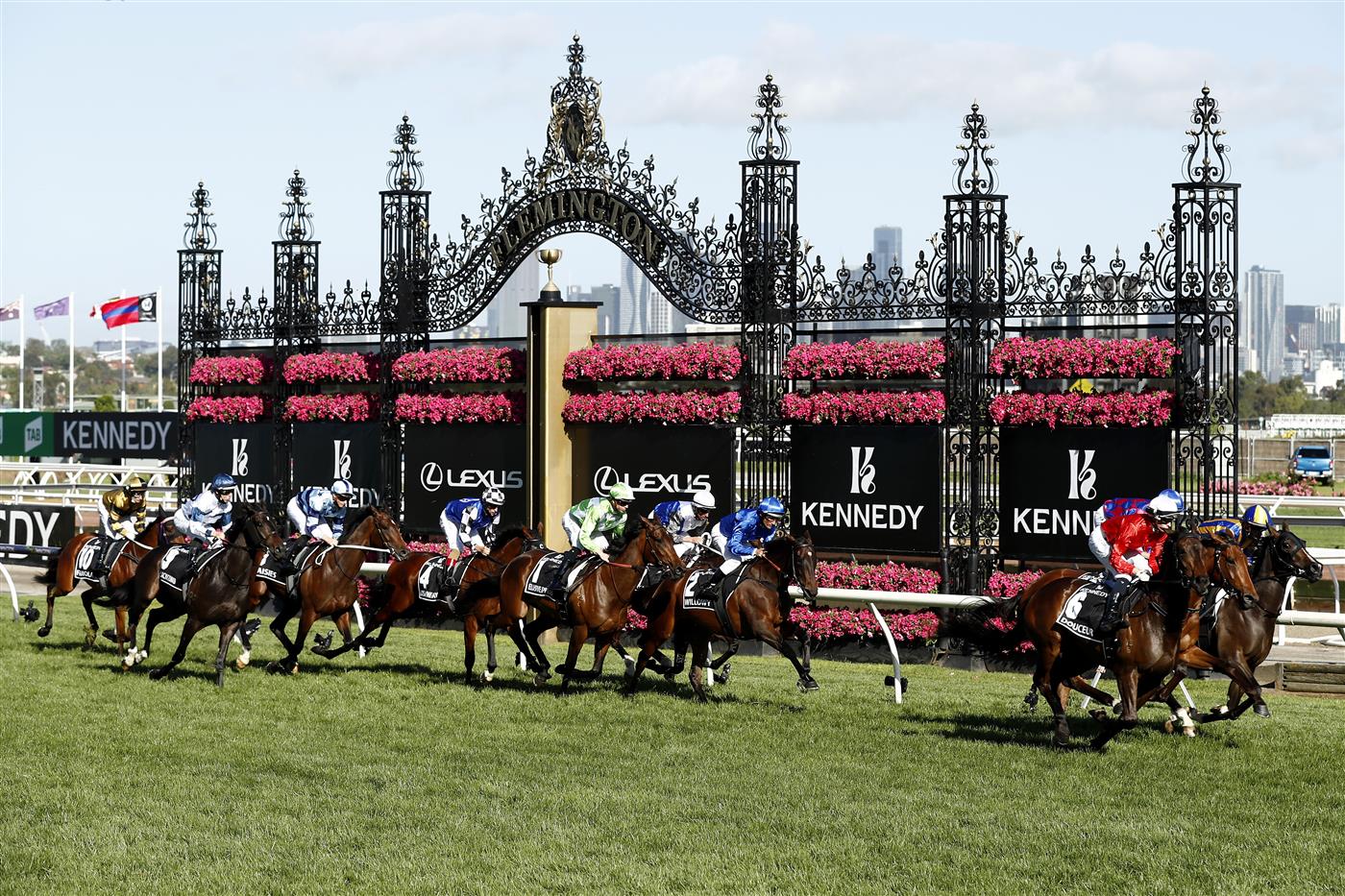 MELBOURNE, AUSTRALIA - NOVEMBER 04: The field gallop past the finish post for the first time in race 8, the Kennedy Oaks during 2021 Oaks Day at Flemington Racecourse on November 04, 2021 in Melbourne, Australia. (Photo by Darrian Traynor/Getty Images)