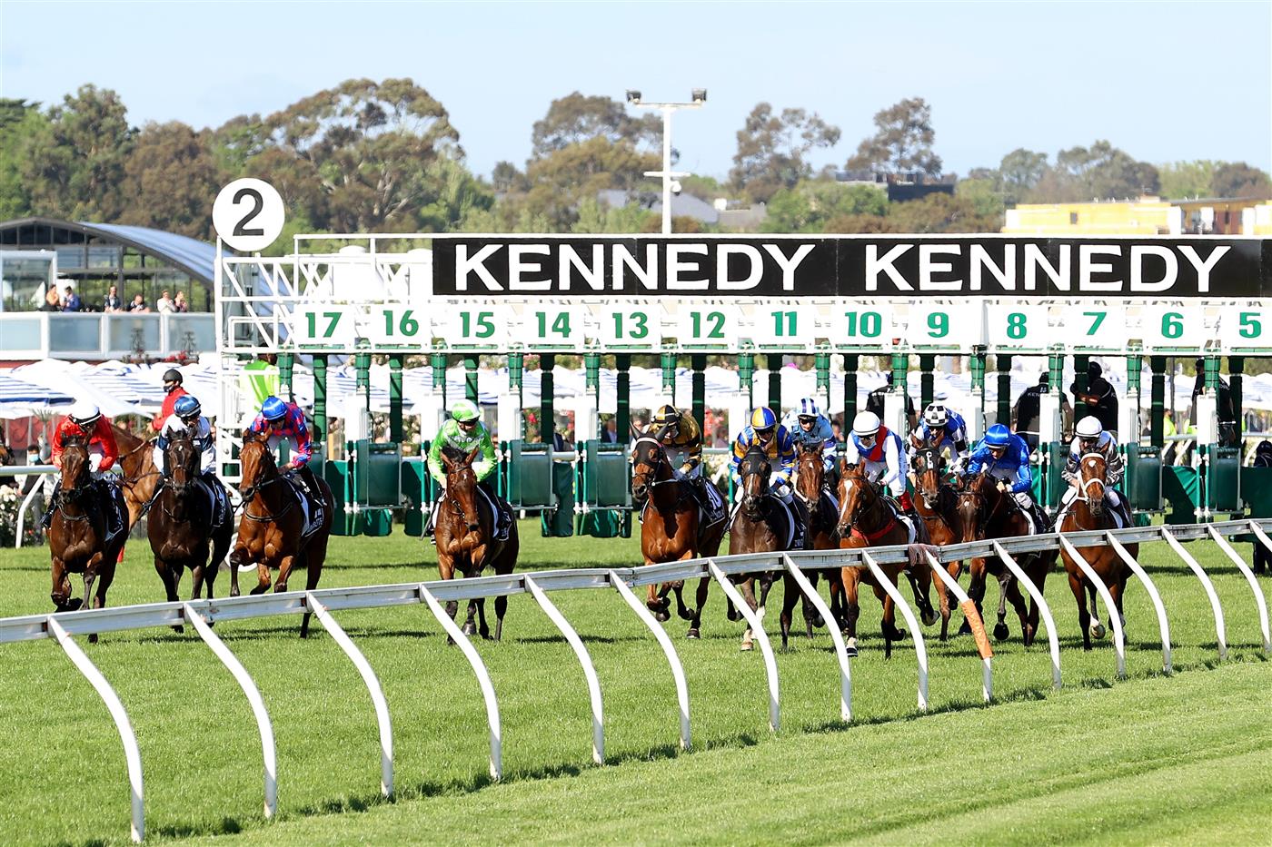 MELBOURNE, AUSTRALIA - NOVEMBER 04: The field jump the barrier in race 8, the Kennedy Oaks during 2021 Oaks Day at Flemington Racecourse on November 04, 2021 in Melbourne, Australia. (Photo by Robert Cianflone/Getty Images)