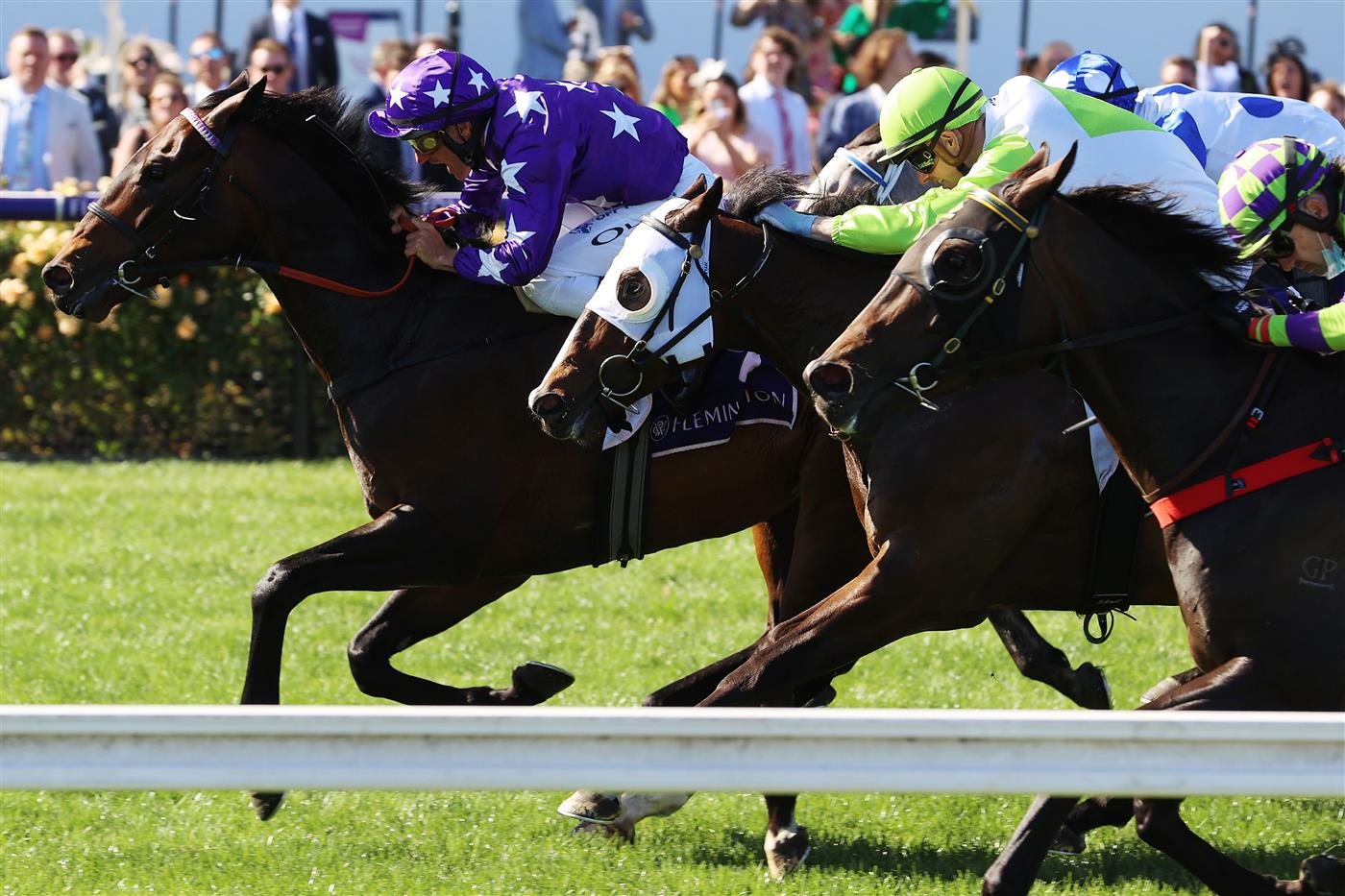 MELBOURNE, AUSTRALIA - NOVEMBER 04: Damien Oliver riding #9 Bermadez leads Jye McNeil riding #12 Typhoon Harmony to win race 7, the Melbourne Cup Carnival Country Final during 2021 Oaks Day at Flemington Racecourse on November 04, 2021 in Melbourne, Australia. (Photo by Robert Cianflone/Getty Images)