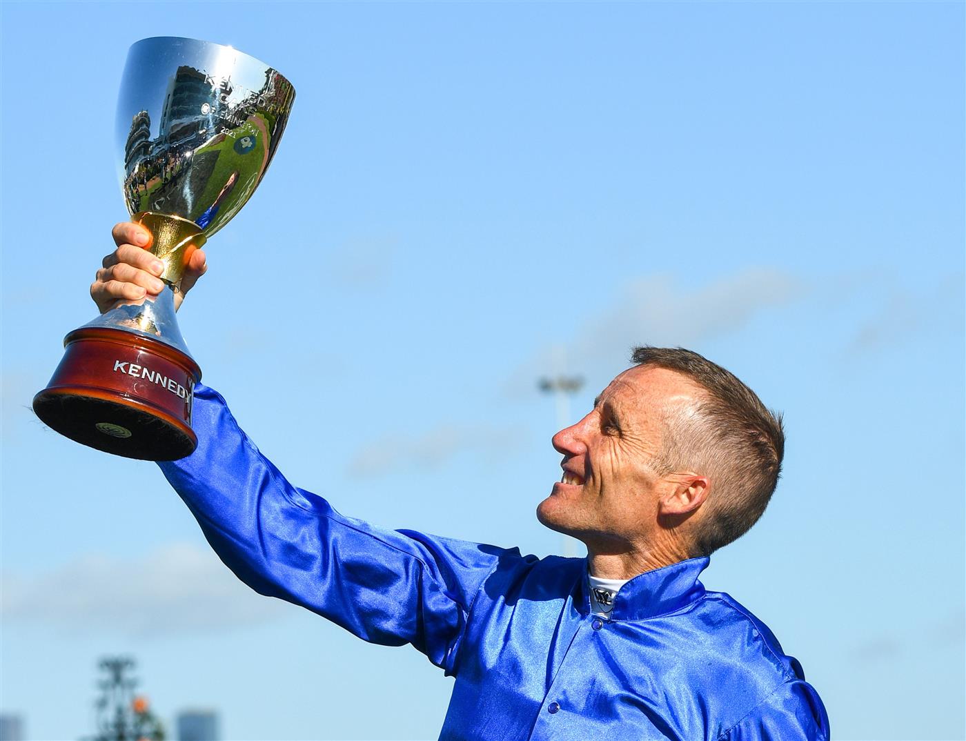 MELBOURNE, AUSTRALIA - NOVEMBER 04: Damien Oliver poses with trophy after riding Willowy to win Race 8, the Kennedy Oaks, during 2021 Oaks Day at Flemington Racecourse on November 04, 2021 in Melbourne, Australia. (Photo by Vince Caligiuri/Getty Images)