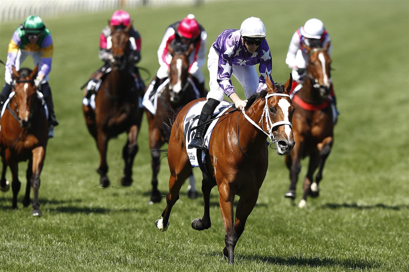 MELBOURNE, AUSTRALIA - NOVEMBER 04: James McDonald riding #16 Espiona wins race 5, the Off The Track Desirable Stakes during 2021 Oaks Day at Flemington Racecourse on November 04, 2021 in Melbourne, Australia. (Photo by Darrian Traynor/Getty Images)