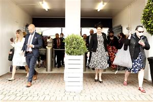MELBOURNE, AUSTRALIA - NOVEMBER 04: Spectators walk through the gates during 2021 Oaks Day at Flemington Racecourse on November 04, 2021 in Melbourne, Australia. (Photo by Darrian Traynor/Getty Images)