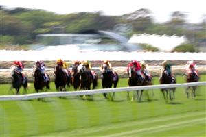 MELBOURNE, AUSTRALIA - NOVEMBER 04: The field gallop down the straight in race 1, the TCL TV Stakes during 2021 Oaks Day at Flemington Racecourse on November 04, 2021 in Melbourne, Australia. (Photo by Robert Cianflone/Getty Images)