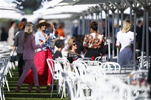 MELBOURNE, AUSTRALIA - NOVEMBER 04: Racegoers are seen during 2021 Oaks Day at Flemington Racecourse on November 04, 2021 in Melbourne, Australia. (Photo by Daniel Pockett/Getty Images)