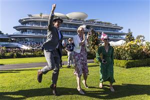 MELBOURNE, AUSTRALIA - NOVEMBER 04: Racegoers celebrate after race 8, the Kennedy Oaks during 2021 Oaks Day at Flemington Racecourse on November 04, 2021 in Melbourne, Australia. (Photo by Daniel Pockett/Getty Images)