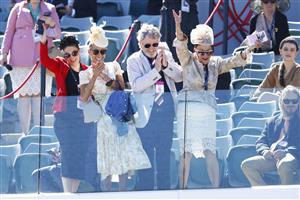 MELBOURNE, AUSTRALIA - NOVEMBER 04: Racegoers celebrate after race 6, the G.H.Mumm Century Stakes during 2021 Oaks Day at Flemington Racecourse on November 04, 2021 in Melbourne, Australia. (Photo by Daniel Pockett/Getty Images)
