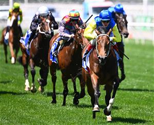 MELBOURNE, AUSTRALIA - NOVEMBER 04: Craig Williams riding #18 See You In Heaven wins race 3, the Darley Ottawa Stakes during 2021 Oaks Day at Flemington Racecourse on November 04, 2021 in Melbourne, Australia. (Photo by Quinn Rooney/Getty Images)