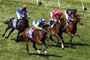 MELBOURNE, AUSTRALIA - NOVEMBER 04: Craig Williams riding #18 See You In Heaven wins race 3, the Darley Ottawa Stakes during 2021 Oaks Day at Flemington Racecourse on November 04, 2021 in Melbourne, Australia. (Photo by Darrian Traynor/Getty Images)