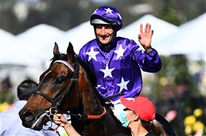 MELBOURNE, AUSTRALIA - NOVEMBER 04: Damien Oliver riding #9 Bermadez celebrates winning race 7, the Melbourne Cup Carnival Country Final during 2021 Oaks Day at Flemington Racecourse on November 04, 2021 in Melbourne, Australia. (Photo by Quinn Rooney/Getty Images)