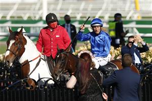 MELBOURNE, AUSTRALIA - NOVEMBER 04: Damien Oliver riding #2 Willowy celebrates winning race 8, the Kennedy Oaks during 2021 Oaks Day at Flemington Racecourse on November 04, 2021 in Melbourne, Australia. (Photo by Darrian Traynor/Getty Images)
