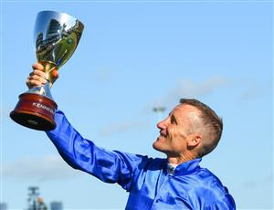 MELBOURNE, AUSTRALIA - NOVEMBER 04: Damien Oliver poses with trophy after riding Willowy to win Race 8, the Kennedy Oaks, during 2021 Oaks Day at Flemington Racecourse on November 04, 2021 in Melbourne, Australia. (Photo by Vince Caligiuri/Getty Images)