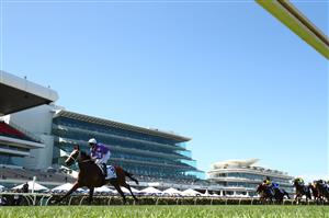 MELBOURNE, AUSTRALIA - NOVEMBER 04: James McDonald riding #16 Espiona wins race 5, the Off The Track Desirable Stakes during 2021 Oaks Day at Flemington Racecourse on November 04, 2021 in Melbourne, Australia. (Photo by Robert Cianflone/Getty Images)