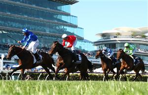 MELBOURNE, AUSTRALIA - NOVEMBER 04: Damien Oliver riding #2 Willowy leads Michael Dee #6 Douceur to win race 8, the Kennedy Oaks during 2021 Oaks Day at Flemington Racecourse on November 04, 2021 in Melbourne, Australia. (Photo by Robert Cianflone/Getty Images)