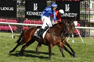 MELBOURNE, AUSTRALIA - NOVEMBER 04: Damien Oliver riding #2 Willowy leads Michael Dee #6 Douceur to win race 8, the Kennedy Oaks during 2021 Oaks Day at Flemington Racecourse on November 04, 2021 in Melbourne, Australia. (Photo by Darrian Traynor/Getty Images)