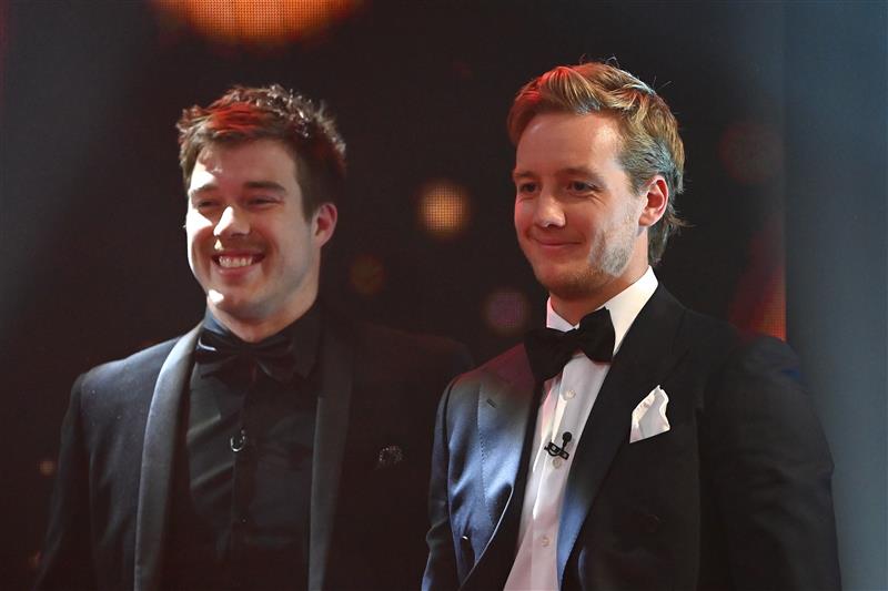MELBOURNE, AUSTRALIA - SEPTEMBER 19: Zach Merrett and Darcy Parish of the Bombers looks on  during the 2021 Brownlow Medal Count at NEP Studios Southbank on September 19, 2021 in Melbourne, Australia. (Photo by Quinn Rooney/Getty Images )