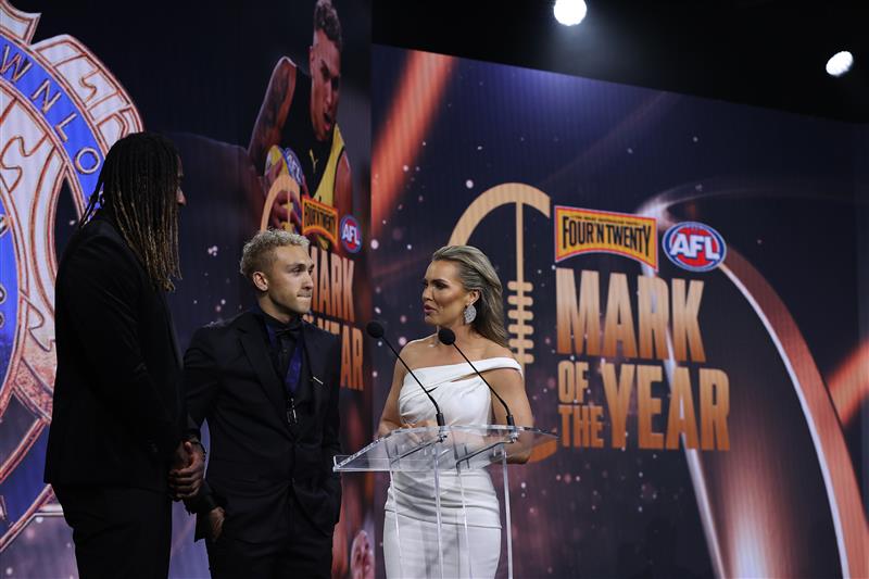 PERTH, AUSTRALIA - SEPTEMBER 19: Shai Bolton (c) of the Tigers is seen on stage after winning the Mark of the year award during the 2021 AFL Brownlow Medal at Optus Stadium on September 19, 2021 in Perth, Australia. (Photo by Paul Kane/Getty Images)