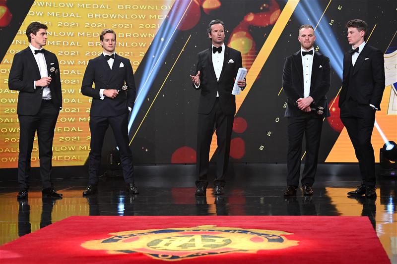 MELBOURNE, AUSTRALIA - SEPTEMBER 19:  Hamish McLachlan talks to Jack Steele of the Saints, Darcy Parish of the Bombers, Tom Mitchell of the Hawks and Sam Walsh of the Blues during the 2021 Brownlow Medal Count at NEP Studios Southbank on September 19, 2021 in Melbourne, Australia. (Photo by Quinn Rooney/Getty Images )