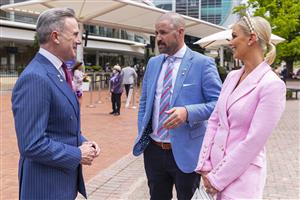 MELBOURNE, AUSTRALIA - NOVEMBER 06: VRC Chairman Neil Wilson (left) meets newlyweds Laurelle McConachy and Taygen Sage pose for a photograph during Paramount+ Stakes Day at Flemington Racecourse on November 06, 2021 in Melbourne, Australia. (Photo by Daniel Pockett/Getty Images)