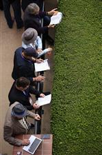 DEL MAR, CALIFORNIA - NOVEMBER 05: Racing fans look on in the paddock area before the start of the the Breeders' Cup Juvenile Fillies race at Del Mar Race Track on November 05, 2021 in Del Mar, California. (Photo by Sean M. Haffey/Getty Images)