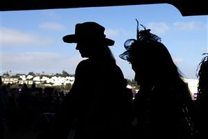 DEL MAR, CALIFORNIA - NOVEMBER 06: Race fans walk past the track after the Breeders' Cup Filly & Mare Turf race at Del Mar Race Track on November 06, 2021 in Del Mar, California. (Photo by Sean M. Haffey/Getty Images)