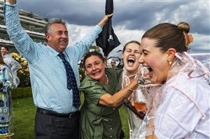 MELBOURNE, AUSTRALIA - NOVEMBER 06: Racegoers celebrate after James McDonald riding #4 Zaaki wins race 8, Paramount+ Mackinnon Stakes during 2021 Paramount+ Stakes Day at Flemington Racecourse on November 06, 2021 in Melbourne, Australia. (Photo by Daniel Pockett/Getty Images)