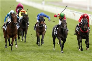 MELBOURNE, AUSTRALIA - NOVEMBER 06: Damian Lane riding #6 Age Of Chivalry wins race 7, Paramount+ Chatham Stakes during 2021 Paramount+ Stakes Day at Flemington Racecourse on November 06, 2021 in Melbourne, Australia. (Photo by Darrian Traynor/Getty Images)