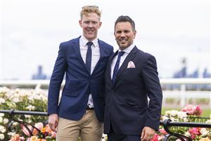 MELBOURNE, AUSTRALIA - NOVEMBER 06: AFL footballer Clayton Oliver of the Melbourne Demons (left) poses for a photograph with a friend during 2021 Paramount+ Stakes Day at Flemington Racecourse on November 06, 2021 in Melbourne, Australia. (Photo by Daniel Pockett/Getty Images)