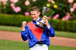 MELBOURNE, AUSTRALIA - NOVEMBER 06: James McDonald poses with the Paramount+ Mackinnon Stakes trophy after riding #4 Zaaki to win race 8, Paramount+ Mackinnon Stakes during 2021 Paramount+ Stakes Day at Flemington Racecourse on November 06, 2021 in Melbourne, Australia. (Photo by Quinn Rooney/Getty Images)