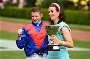 MELBOURNE, AUSTRALIA - NOVEMBER 06: James McDonald and trainer Annabel Neasham pose with the Paramount+ Mackinnon Stakes trophy after #4 Zaaki won race 8, Paramount+ Mackinnon Stakes during 2021 Paramount+ Stakes Day at Flemington Racecourse on November 06, 2021 in Melbourne, Australia. (Photo by Quinn Rooney/Getty Images)