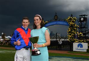 MELBOURNE, AUSTRALIA - NOVEMBER 06: James McDonald and trainer Annabel Neasham pose with the Paramount+ Mackinnon Stakes trophy after #4 Zaaki won Race 8, the Paramount Plus Mackinnon Stakes, during 2021 Paramount + Stakes Day at Flemington Racecourse on November 06, 2021 in Melbourne, Australia. (Photo by Vince Caligiuri/Getty Images)
