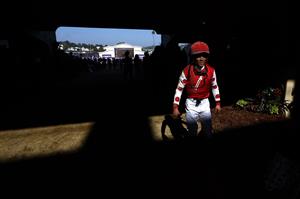 DEL MAR, CALIFORNIA - NOVEMBER 06: Jockey Joel Rosario who rode Snapper Sinclair in the Breeders' Cup Dirt Mile race at Del Mar Race Track walks back to the jockey area on November 06, 2021 in Del Mar, California. (Photo by Sean M. Haffey/Getty Images)