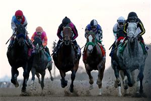 DEL MAR, CALIFORNIA - NOVEMBER 06: Knicks Go with jockey Joel Rosario aboard (R) leads the field into the first turn during the Breeders' Cup Classic at Del Mar Race Track on November 06, 2021 in Del Mar, California. (Photo by Rob Carr/Getty Images)