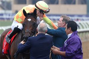 DEL MAR, CALIFORNIA - NOVEMBER 05: Jockey Jose Ortiz and owner Bobby Flay celebrate after Ortiz rode Pizza Bianca to win the Breeders' Cup Juvenile Fillies Turf at Del Mar Race Track on November 05, 2021 in Del Mar, California. (Photo by Rob Carr/Getty Images)