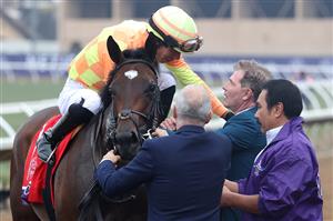 DEL MAR, CALIFORNIA - NOVEMBER 05: Jockey Jose Ortiz and owner Bobby Flay celebrate after Ortiz rode Pizza Bianca to win the Breeders' Cup Juvenile Fillies Turf at Del Mar Race Track on November 05, 2021 in Del Mar, California. (Photo by Rob Carr/Getty Images)